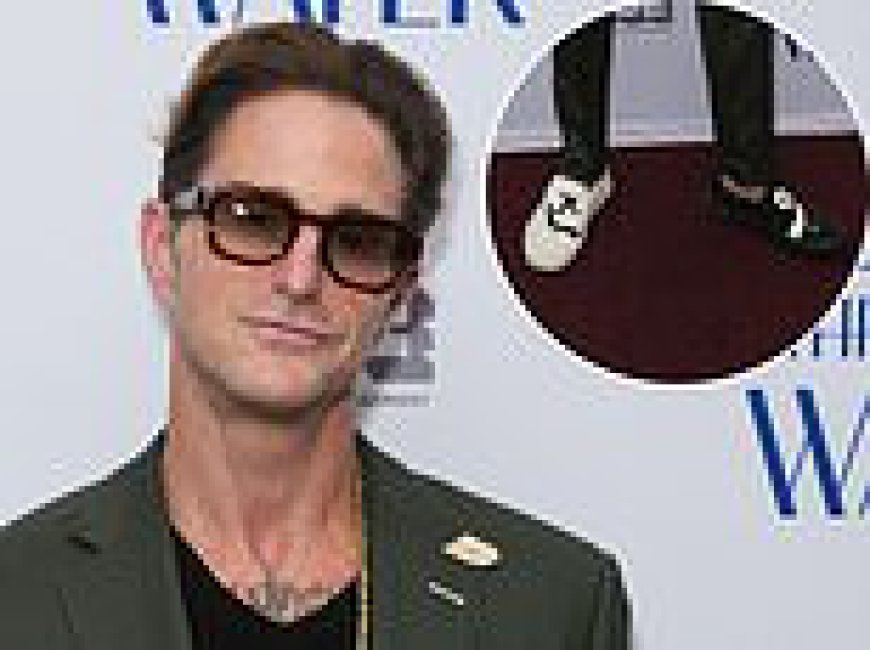 Nepo baby looks the spitting image of his A-list father as he makes rare public appearance while wearing odd shoes - but can YOU guess who he is?