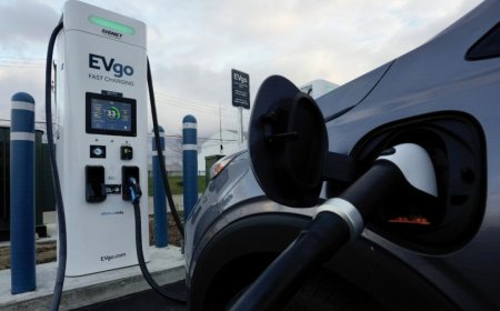 Companies hit the brakes on EVs, lay off thousands