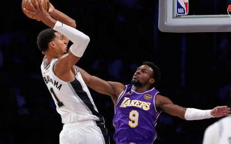 Spurs' Victor Wembanyama dunks over Lakers' Bronny James
