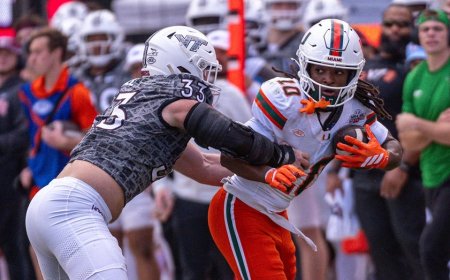 Miami football staffer avoids disaster after Hurricanes player barrels over her