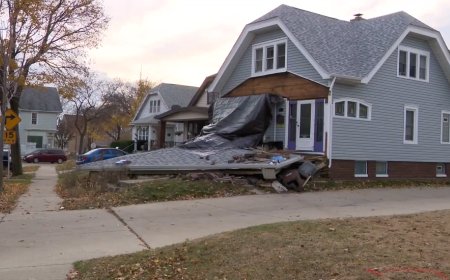 Minivan crashes into home, killing driver