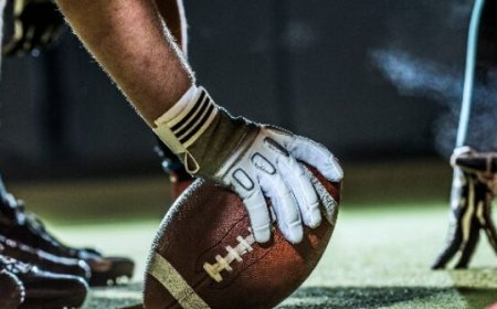 WATCH: High School Coach Shoves Opposing QB, Sparks Sideline Brawl