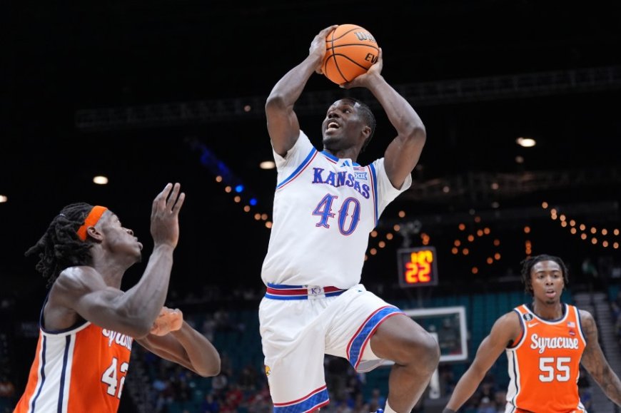 Double-doubles by Tre White and Flory Bidunga help Kansas beat Syracuse